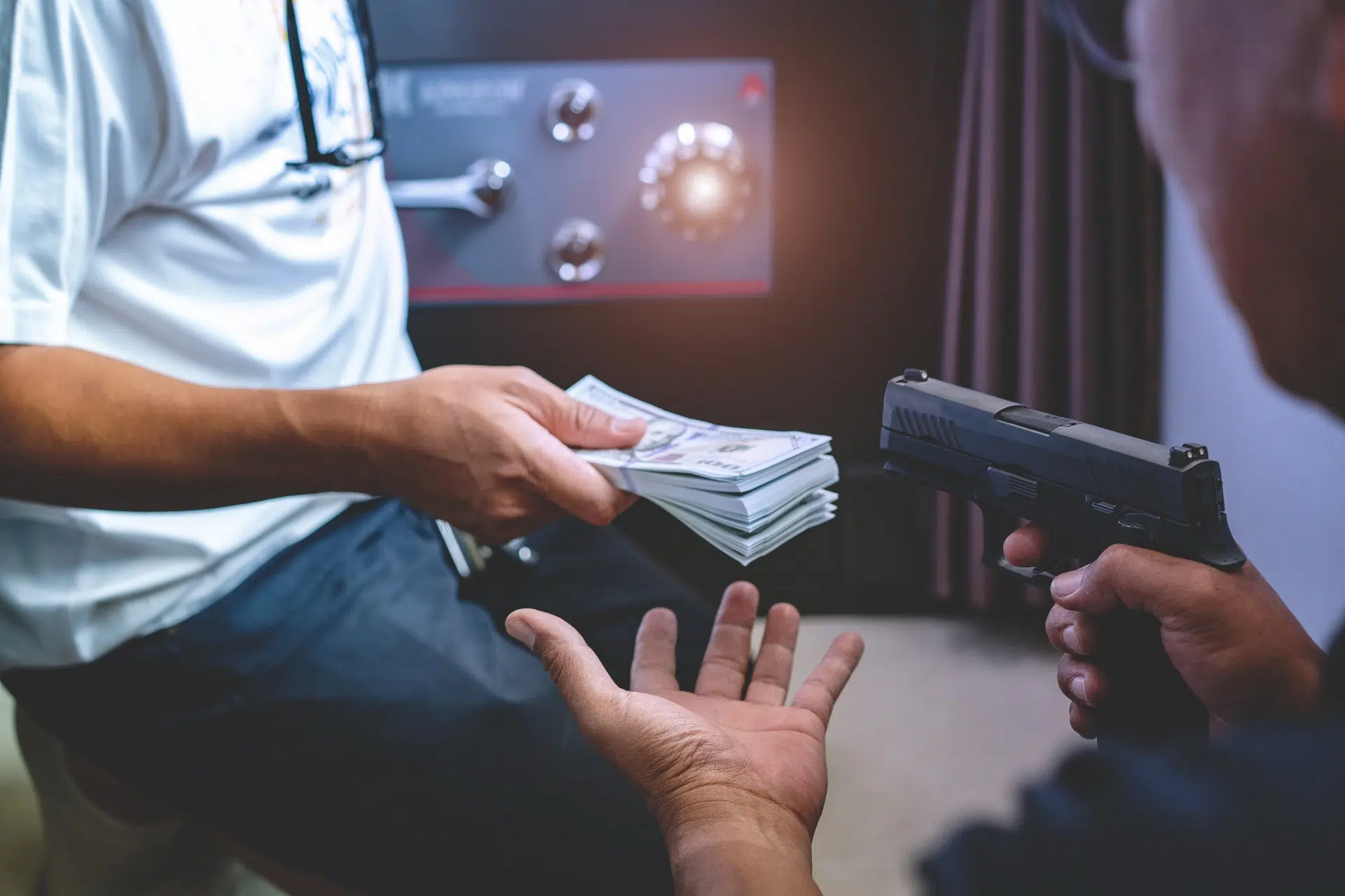 A tense money exchange with a gun involved
