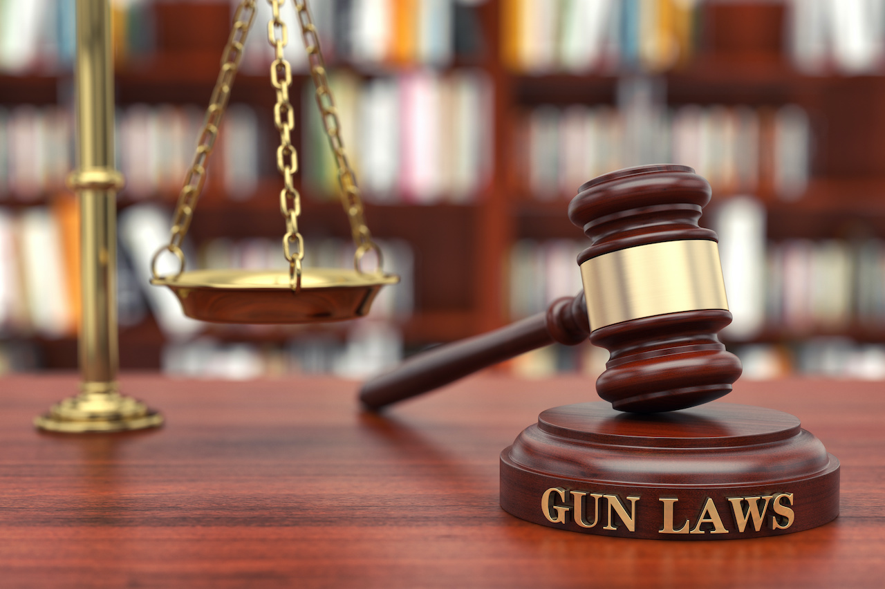 Wooden Gavel With Gun Law Text | Criminal Defense Attorney in LA​​​​ | Wegman & Levin