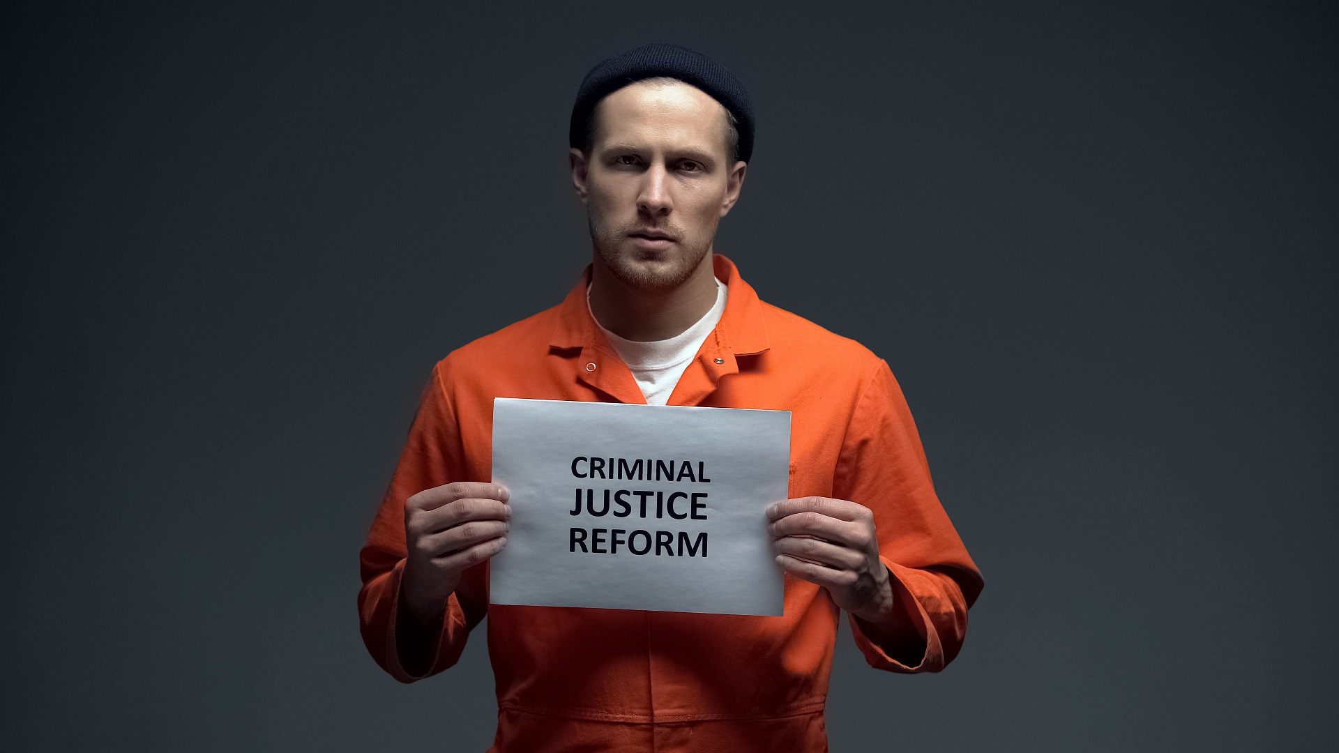Male Prisoner Holding Criminal Justice Reform Sign | Criminal Attorney in LA | Wegman & Levin