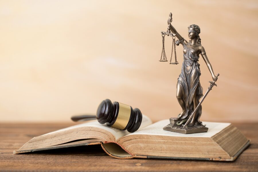 Statue of Lady Justice and gavel on wooden table | Drug Charges Lawyer | Wegman & Levin