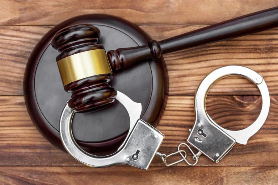 Handcuffs And Gavel In Courtroom | Sex Crime Lawyer in Los Angeles​​ | Wegman & Levin