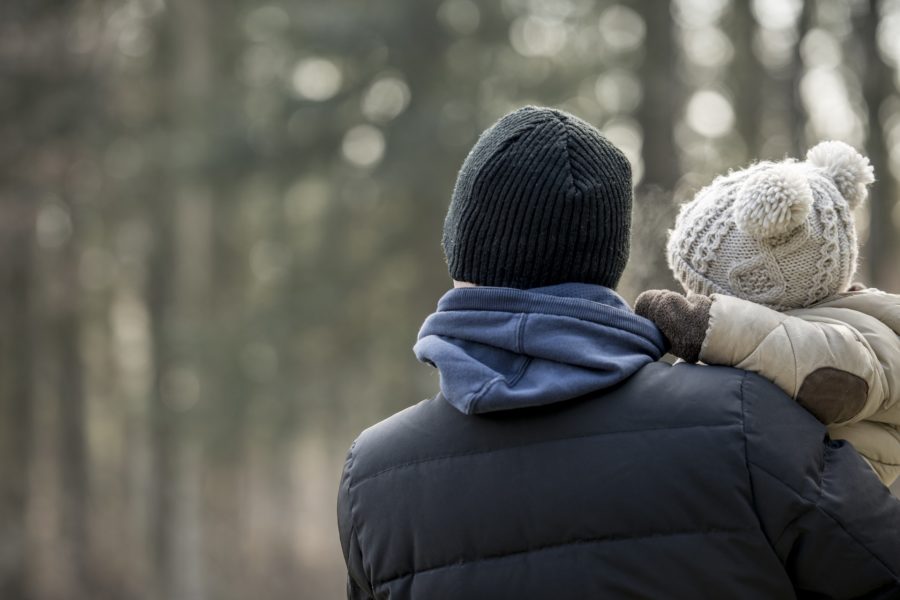 Man Holding a Child on a Winter Day | Criminal Attorney in Los Angeles California | Wegman & Levin