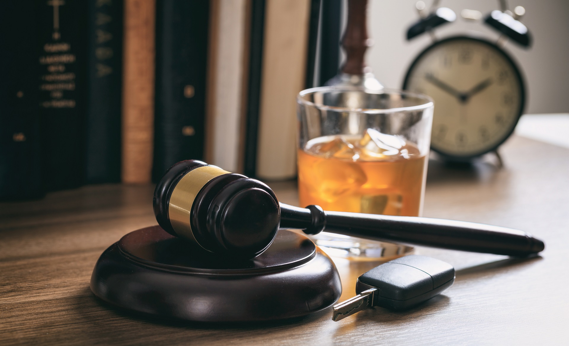 A judge's gavel and a glass of wine on a desk | DUI Defense Lawyer in LA | Wegman & Levin
