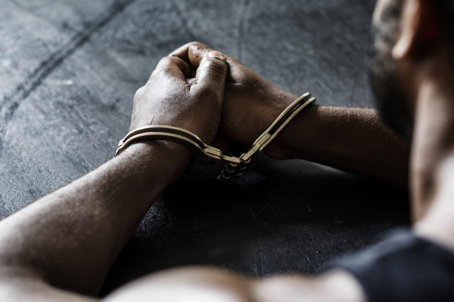 Arrested Man with Handcuffs on Wrists | Drug Charges Attorney​​ in Los Angeles | Wegman & Levin