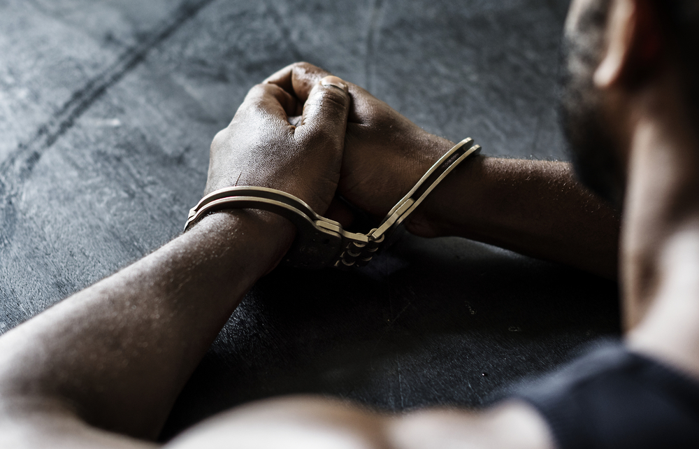 Arrested Man with Handcuffs on Wrists | Drug Charges Attorney​​ in Los Angeles | Wegman & Levin