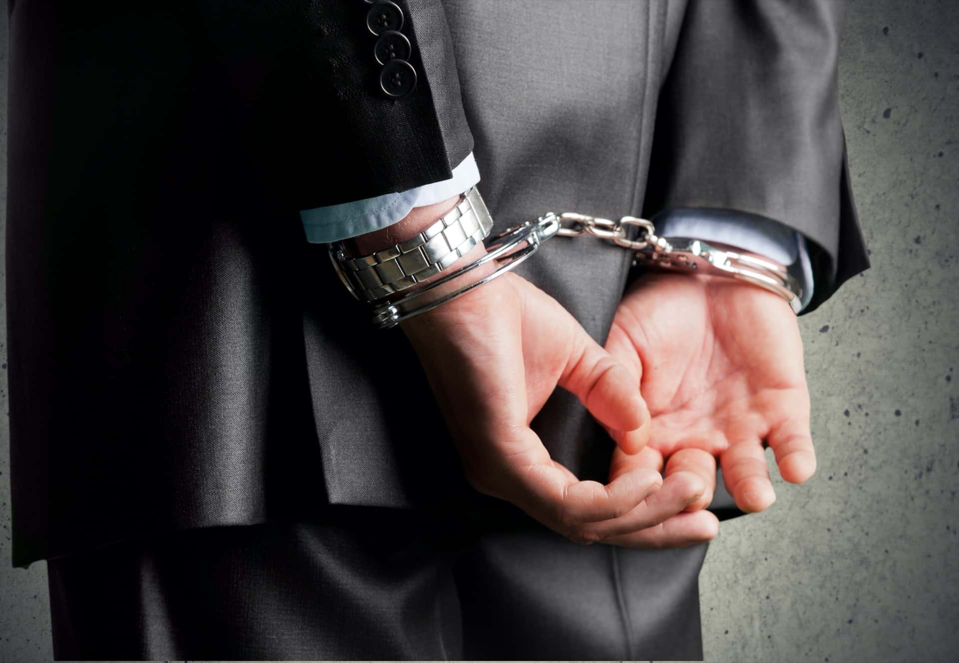 Businessman in Handcuffs | White Collar Attorney​​ in Los Angeles​​ | Wegman & Levin
